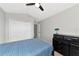 Well-lit bedroom with double bed and large closet at 1228 Cord Grass Ct, Wesley Chapel, FL 33543