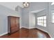 Bright dining room with hardwood floors and built-in cabinetry at 1228 Cord Grass Ct, Wesley Chapel, FL 33543