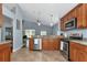 Modern kitchen featuring granite counters and stainless steel appliances at 1228 Cord Grass Ct, Wesley Chapel, FL 33543