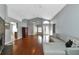 Living room with hardwood floors, high ceilings and view to entryway at 1228 Cord Grass Ct, Wesley Chapel, FL 33543