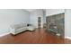 Living room with hardwood floors, L-shaped sofa, fireplace, and high ceilings at 1228 Cord Grass Ct, Wesley Chapel, FL 33543