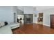 Living room with hardwood floors, L-shaped sofa, fireplace, and high ceilings at 1228 Cord Grass Ct, Wesley Chapel, FL 33543