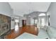 Living room with hardwood floors, high ceilings and view to entryway at 1228 Cord Grass Ct, Wesley Chapel, FL 33543