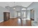 Living room with hardwood floors, high ceilings and view to entryway at 1228 Cord Grass Ct, Wesley Chapel, FL 33543