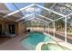 Inviting screened pool and spa at 1228 Cord Grass Ct, Wesley Chapel, FL 33543