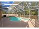 Inviting screened pool and spa at 1228 Cord Grass Ct, Wesley Chapel, FL 33543