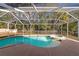 Inviting screened pool and spa at 1228 Cord Grass Ct, Wesley Chapel, FL 33543