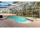 Inviting screened pool and spa at 1228 Cord Grass Ct, Wesley Chapel, FL 33543