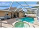 Inviting screened pool and spa at 1228 Cord Grass Ct, Wesley Chapel, FL 33543