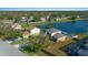 Aerial view of house and surrounding neighborhood with a backyard pool at 221 111 E St, Bradenton, FL 34212