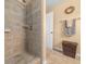 Shower with beige tile and built in shelf at 221 111 E St, Bradenton, FL 34212