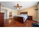 Spacious bedroom with wood flooring and a ceiling fan at 221 111 E St, Bradenton, FL 34212