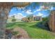 Two-story house with tan garage door and lush landscaping at 221 111 E St, Bradenton, FL 34212