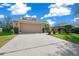 Two story house with a large driveway and well-manicured lawn at 221 111 E St, Bradenton, FL 34212