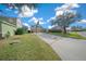 Two-story house with a basketball hoop and large front yard at 221 111 E St, Bradenton, FL 34212