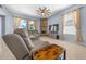 Relaxing living room featuring a corner fireplace at 221 111 E St, Bradenton, FL 34212