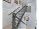 Elegant staircase with gray wood and wrought iron railing at 221 111 E St, Bradenton, FL 34212