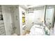 Modern bathroom with subway tile and built-in shelving at 10215 Regal Dr # 19, Largo, FL 33774