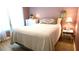 Cozy bedroom with a comfortable bed and charming decor at 10215 Regal Dr # 19, Largo, FL 33774