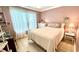 Charming bedroom with a full-size bed and soft color scheme at 10215 Regal Dr # 19, Largo, FL 33774