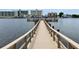 Wooden walkway dock leading to the water, great for fishing and relaxation at 10215 Regal Dr # 19, Largo, FL 33774