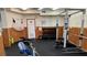 Small weight room with free weights and weight machines at 10215 Regal Dr # 19, Largo, FL 33774