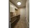 Convenient laundry room with built-in cabinets and counter space at 4152 Banbury Cir, Parrish, FL 34219