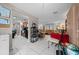 View of kitchen and adjoining living area with dining table at 5111 Smith Ryals Rd, Plant City, FL 33567