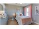 Charming bedroom with a pink and gray theme at 30922 Wild Juniper Ct, Brooksville, FL 34602