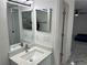 Bright bathroom boasts a vanity with quartz countertop, modern faucet, and updated shower at 3619 Marco Dr, Tampa, FL 33614