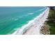 Expansive beach with ocean waves at 610 Fox St, Longboat Key, FL 34228