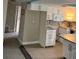 Kitchen with white cabinets and granite countertops at 610 Fox St, Longboat Key, FL 34228