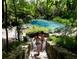 Steps leading down to a crystal-clear natural spring at 13233 Gulf Bay Ln, Spring Hill, FL 34609