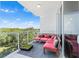 Relaxing balcony with seating and treetop views at 920 N Osceola Ave # 604, Clearwater, FL 33755