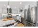 Stylish kitchen with white cabinets, stainless steel appliances, and an island at 920 N Osceola Ave # 604, Clearwater, FL 33755