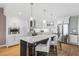 Spacious kitchen featuring white cabinets, quartz counters, and island seating at 920 N Osceola Ave # 604, Clearwater, FL 33755