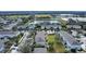 Aerial view of townhomes with gray roofs and green lawns at 6266 Triple Tail Ct # 103, Lakewood Ranch, FL 34202