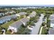 Aerial view of townhome community with landscaping and roads at 6266 Triple Tail Ct # 103, Lakewood Ranch, FL 34202