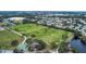 Aerial view of a park with soccer fields, a playground, and a pond at 6266 Triple Tail Ct # 103, Lakewood Ranch, FL 34202