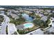 Aerial view of townhomes community with kidney shaped pool at 6266 Triple Tail Ct # 103, Lakewood Ranch, FL 34202