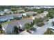 Aerial view of townhomes, roads, and surrounding landscape at 6266 Triple Tail Ct # 103, Lakewood Ranch, FL 34202