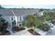 Aerial view of townhouses with gray roofs and landscaping at 6266 Triple Tail Ct # 103, Lakewood Ranch, FL 34202