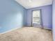 Bedroom with light blue and purple walls and carpet at 6266 Triple Tail Ct # 103, Lakewood Ranch, FL 34202