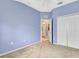 Bedroom with light blue walls, carpet, and ceiling fan at 6266 Triple Tail Ct # 103, Lakewood Ranch, FL 34202