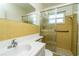 Bathroom with yellow tile, shower/tub combo and vanity at 9205 40Th N Way # 5, Pinellas Park, FL 33782