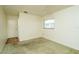 Bright bedroom with neutral walls, carpet flooring and a door to hallway at 9205 40Th N Way # 5, Pinellas Park, FL 33782