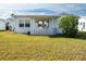 Exterior view of house with patio and lawn at 9205 40Th N Way # 5, Pinellas Park, FL 33782