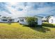 Exterior view of house with grassy lawn and other houses at 9205 40Th N Way # 5, Pinellas Park, FL 33782