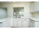 Kitchen features a large island with seating and white cabinetry at 9205 40Th N Way # 5, Pinellas Park, FL 33782