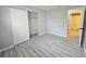 Bright bedroom with spacious closet and wood-look flooring at 12117 Topaz St, Spring Hill, FL 34608